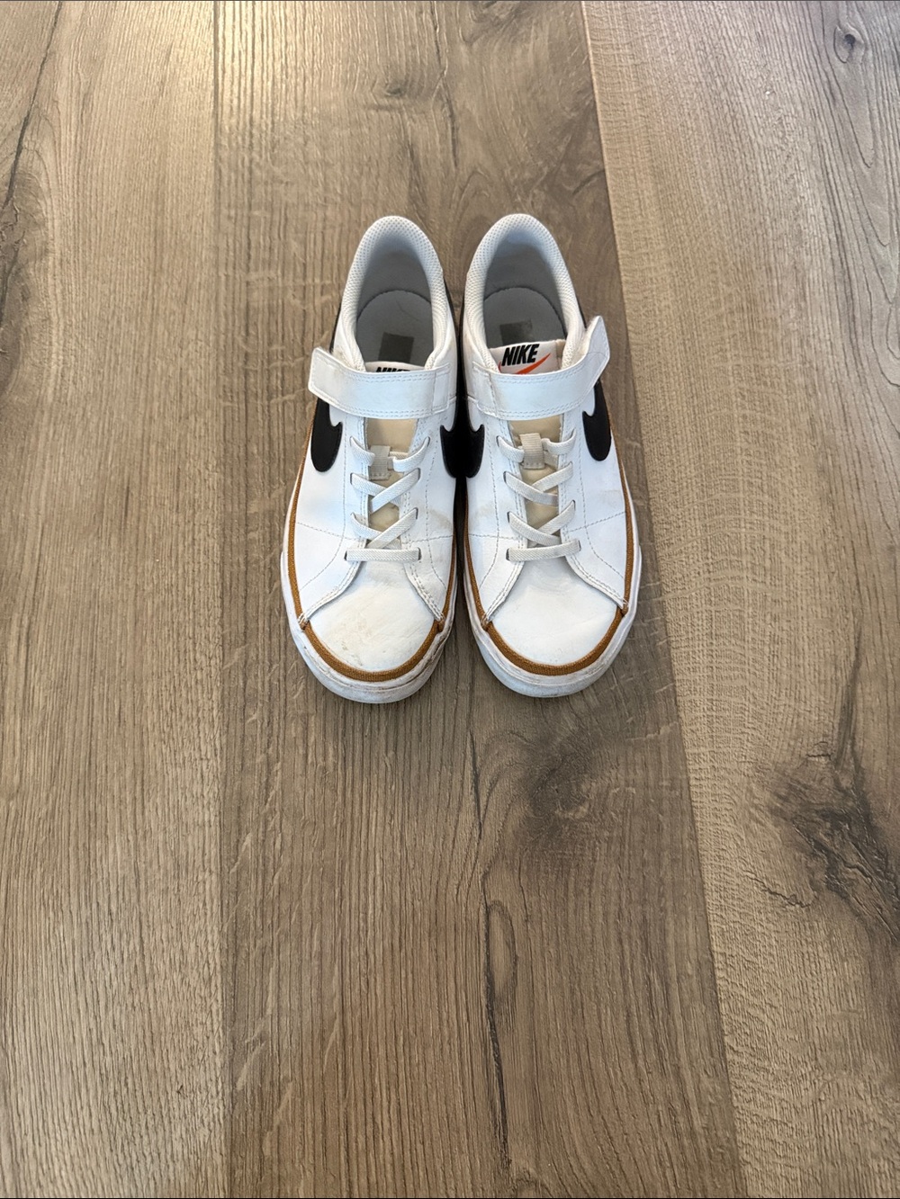 Nike Kids White Sneakers with Black Swoosh and Tan Trim